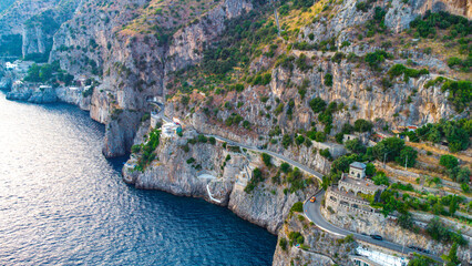 The Amalfi Coast is a breathtaking stretch of coastline in southern Italy, known for its vertiginous cliffs adorned with colorful villages, turquoise waters, and lush terraced gardens. 