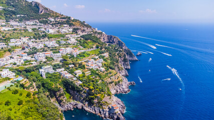 The Amalfi Coast is a breathtaking stretch of coastline in southern Italy, known for its vertiginous cliffs adorned with colorful villages, turquoise waters, and lush terraced gardens. 