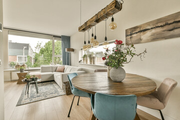 a living room with wood flooring and white walls that have been painted in the same color as it appears