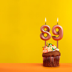 Number 89 birthday candle - Celebration on yellow background
