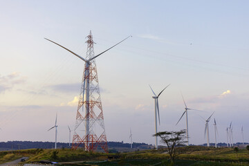 Windmill turbine farm for electricity generation on landscape mountain at sunset sky, Green power industry resouces, Sustainable and clean energy generator from wind and frieldly with enviroement
