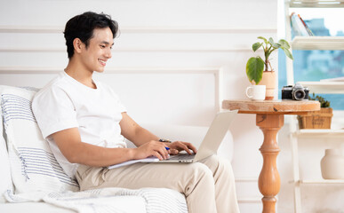 Photo of young Asian man at home