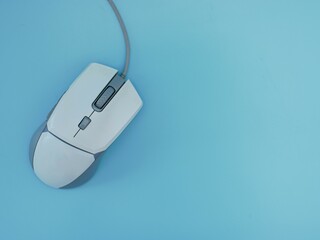 Computer wired gaming mouse white Isolated on a blue background