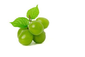Bunch of fresh green grapes, green leaves isolated on a white background.