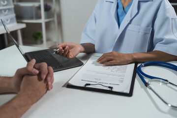 Asian female doctor or medical specialist examining a patient Ask for symptoms, give advice, recommend medication, plan treatment guidelines and preventive care. Concept of health checkup Prevention
