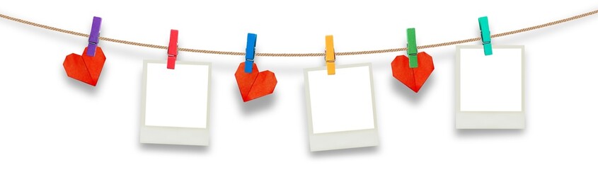 Retro photo frames hanging on rope isolated on transparency background.