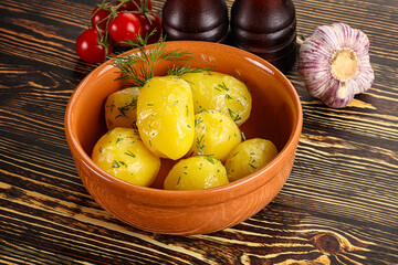Boiled potato with oil and dill