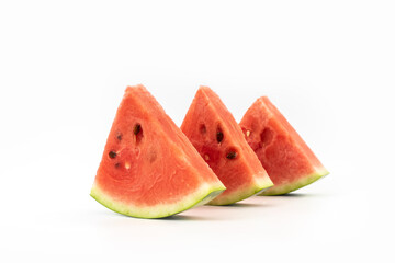 closeup of some pieces of refreshing watermelon on a white background