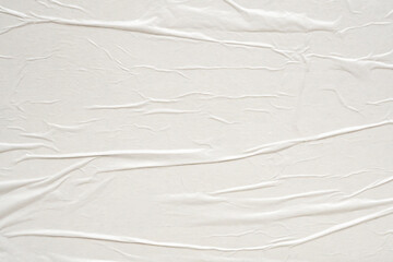 Fototapeta na wymiar White blank crumpled and creased paper poster texture background