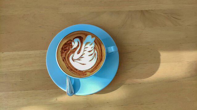 Hot Milk Coffee On Wooden Table From Top View