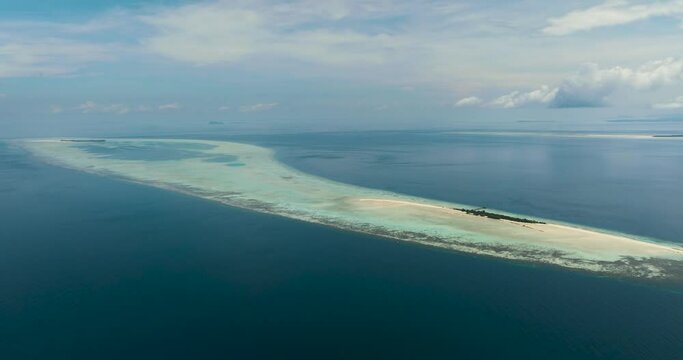 Aerial drone of Timba Timba island with beach and coral reef. Tun Sakaran Marine Park. Borneo, Sabah, Malaysia.