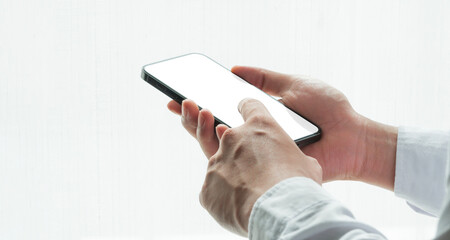 hands of doctor using mobile phone with blank screen, sending test results and giving online consultation or chatting to patients,remote medical consulting.