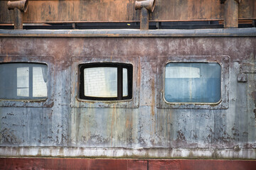 Abandoned distinctive dormer windows in close up