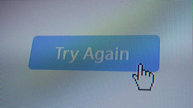 Mouse cursor clicking Try Again automated button on a computer display screen