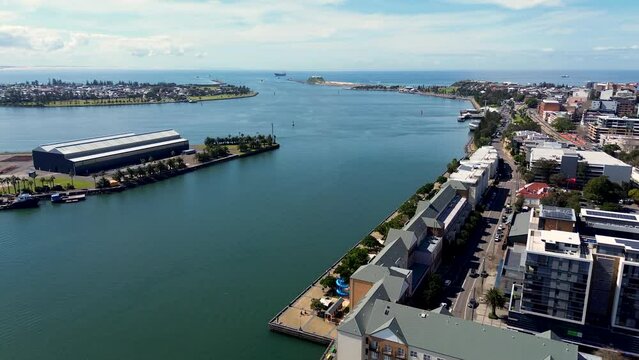 Drone aerial shot of Hunter River channel inlet Newcastle harbour Honeysuckle wharf Stockton Carrington NSW CBD travel tourism coal Australia 4K