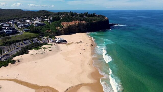 Drone aerial shot of Redhead cliff headland coastline sandy beach Pacific Ocean sea waves nature travel tourism Newcastle Lake Macquarie NSW Australia 4K