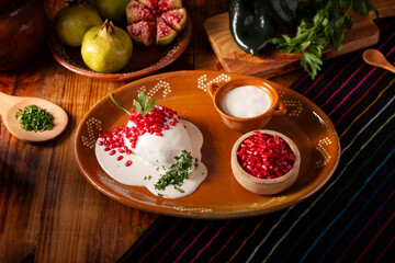 Chile en Nogada, Typical dish from Mexico. Prepared with poblano chili stuffed with meat and fruits and covered with a walnut sauce. Named as the quintessential Mexican dish for national holidays.