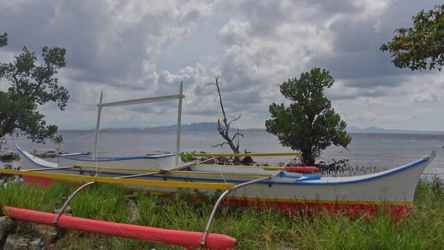 An abandoned fishing boat sits high above the water line in Surigao City, Philippines.