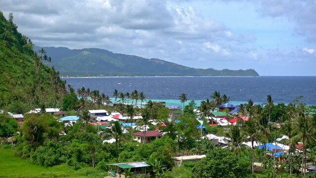 View over Looc beach towards Banbanon in Surigao Del Norte Philippines. A small tropical fishing village and popular local beach.