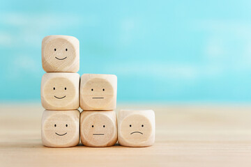 Top view image of table with note of happy and sad face. concept of happiness emotion and satisfaction