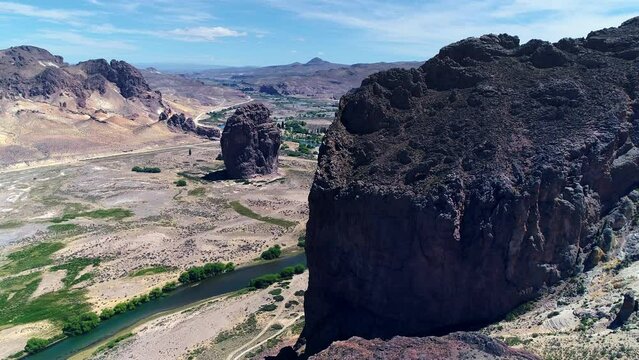 Opening shot with a drone on the stone of piedra parada in Argentina, provincia of Chubut. Incredible stone more than 240 meter high under a Sunny day.