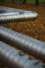 Metal pipes on the street. pipes from the pipeline. gas pipeline for gas pumping. heat-pipe. large...