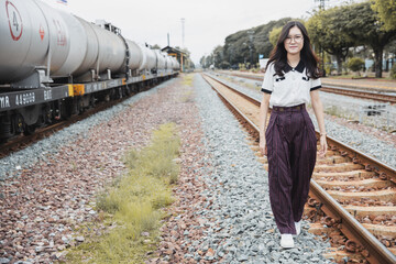 portrait happy asian woman lady on railway train station locomotive industry leisure relax smile image