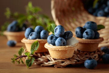 Small tartlets with fresh blueberries and mint.