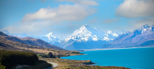 The road trip with mountain landscape view of blue sky background over Aoraki mount cook national...