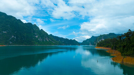 Aerial view at Khao Sok national park Cheow Lan Dam lake with blue sky background  in Surat Thani, Thailand