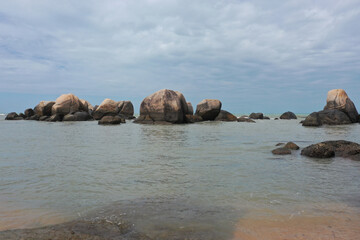 Fototapeta na wymiar Landscape of rocks and flowing sea water on the coast 