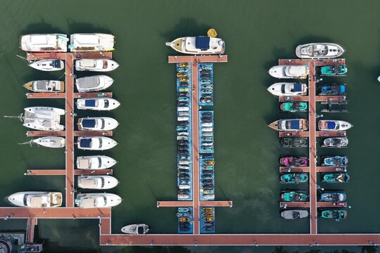 Aerial photography harbor top view of motor boats and luxury yachts