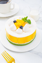 Mango cream cake, indoor close-up, photography