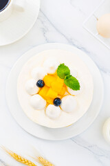 Mango cream cake, indoor close-up, photography