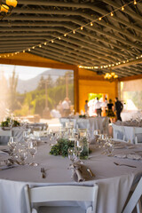 Fototapeta na wymiar Charming table set up awaits guests at rustic barn wedding