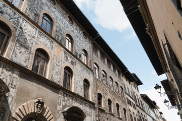 Building facade decorated with beautiful fresco, Florence