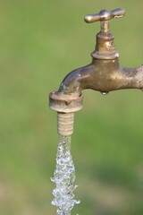 Drinking water coming out of a tap