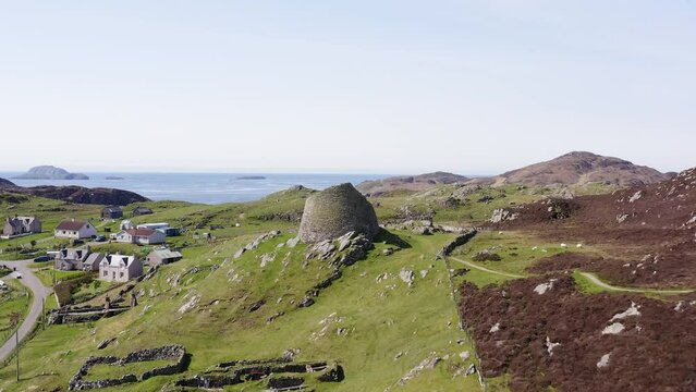 Advancing drone shot of the 'Dun Carloway Broch' on the west coast of the Isle of Lewis, part of the Outer Hebrides of Scotland. The broch is a tourist attraction first built around 100AD.