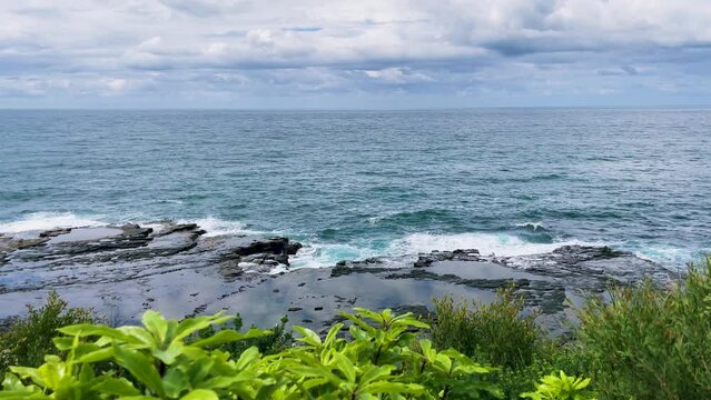 4k Video -Panoramic view of waves crashing on the coastline at Crookhaven Heads Lookout, close to Culburra Beach in Shoalhaven Bight, South Coast, NSW, Australia.