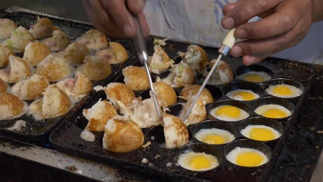 thailand night market street food booth cooking squid octopus cuttlefish balls