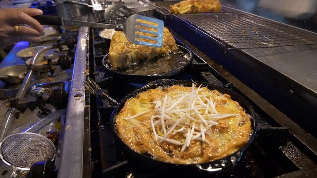 pan fried oyster pan cake omelette in thailand night market street food