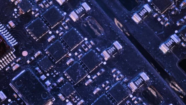 Microcircuit macro close-up. Cyberpunk tracking shot. Modern nano-digital technologies chips semiconductors and microchips.