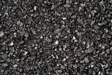 Ion-exchange carbon for water softening beads or granules texture background. carbon water filter for residential drinking or industrial texture surface,top view