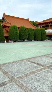 HD Video-Vertical- Panning around 360 degrees inside the main courtyard of  Nan Tien Buddhist Temple in Wollongong, NSW, Australia, showing the exquisite architectural details, and colourful roofs.