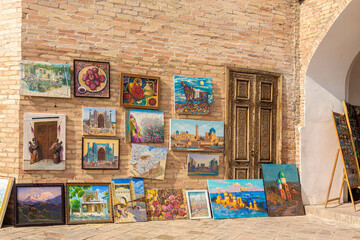Paintings in street market. Art souvenir and gift concept. April 10, 2023. Tashkent, Uzbekistan