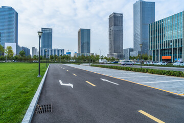 Fototapeta na wymiar empty asphalt road front of modern buildings
