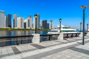 Obraz premium empty floor and city skyline under blue sky, tianjin, china