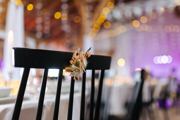 Decoration on the chairs at a wedding venue