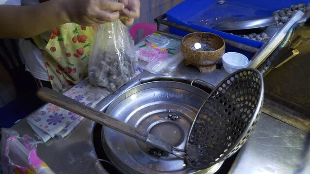 thailand night market street food boiled blood clams cooked