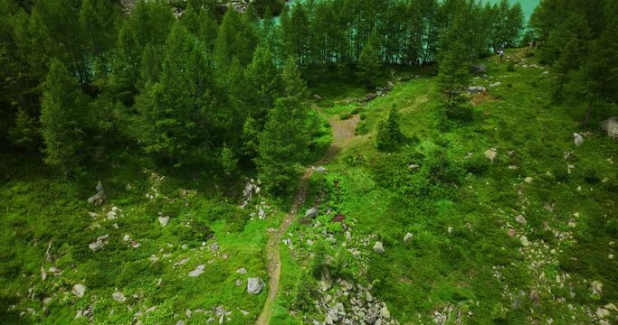 Aerial reveal of Lake Lagazzuolo in Valmalenco valley of Valtellina in summer season, Northern Italy